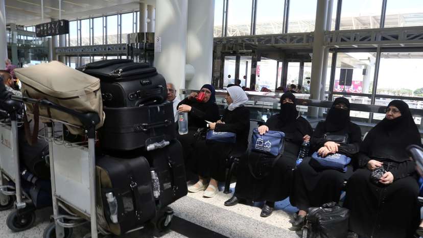 FILE PHOTO: Syrian Haj pilgrims heading to Mecca wait to board an airplane at Beirut international airport