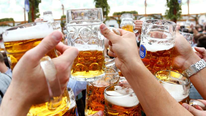FILE PHOTO: Visitors toast with beer