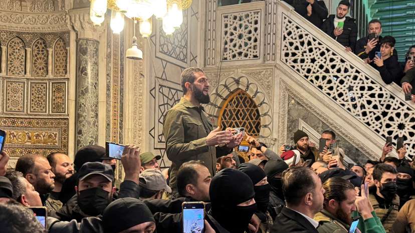 FILE PHOTO: Top rebel commander Abu Mohammed al-Golani speaks to a crowd at Ummayad Mosque in Damascus