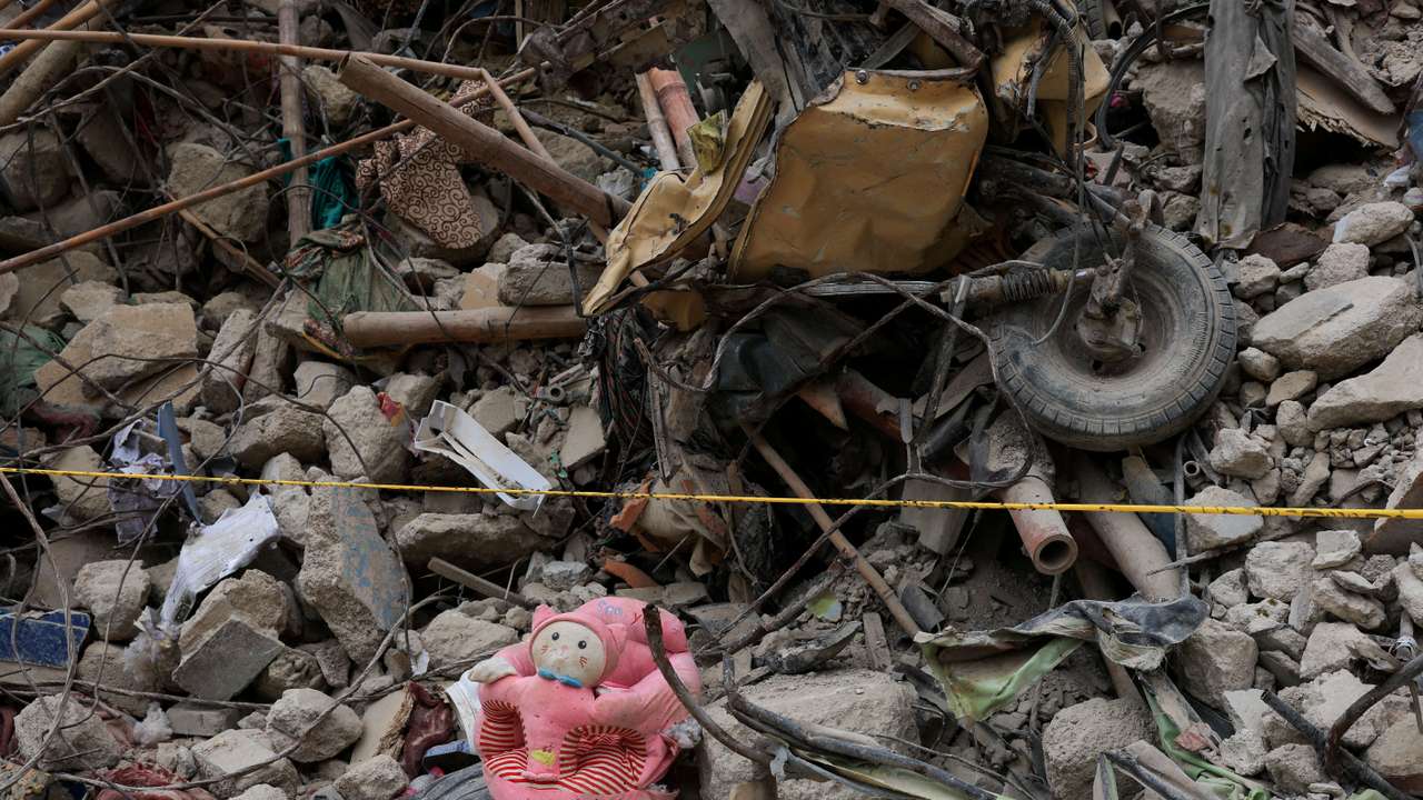 Personal belongings lie amid the rubble of a five-storey residential building that collapsed on Friday, July 4, in Karachi