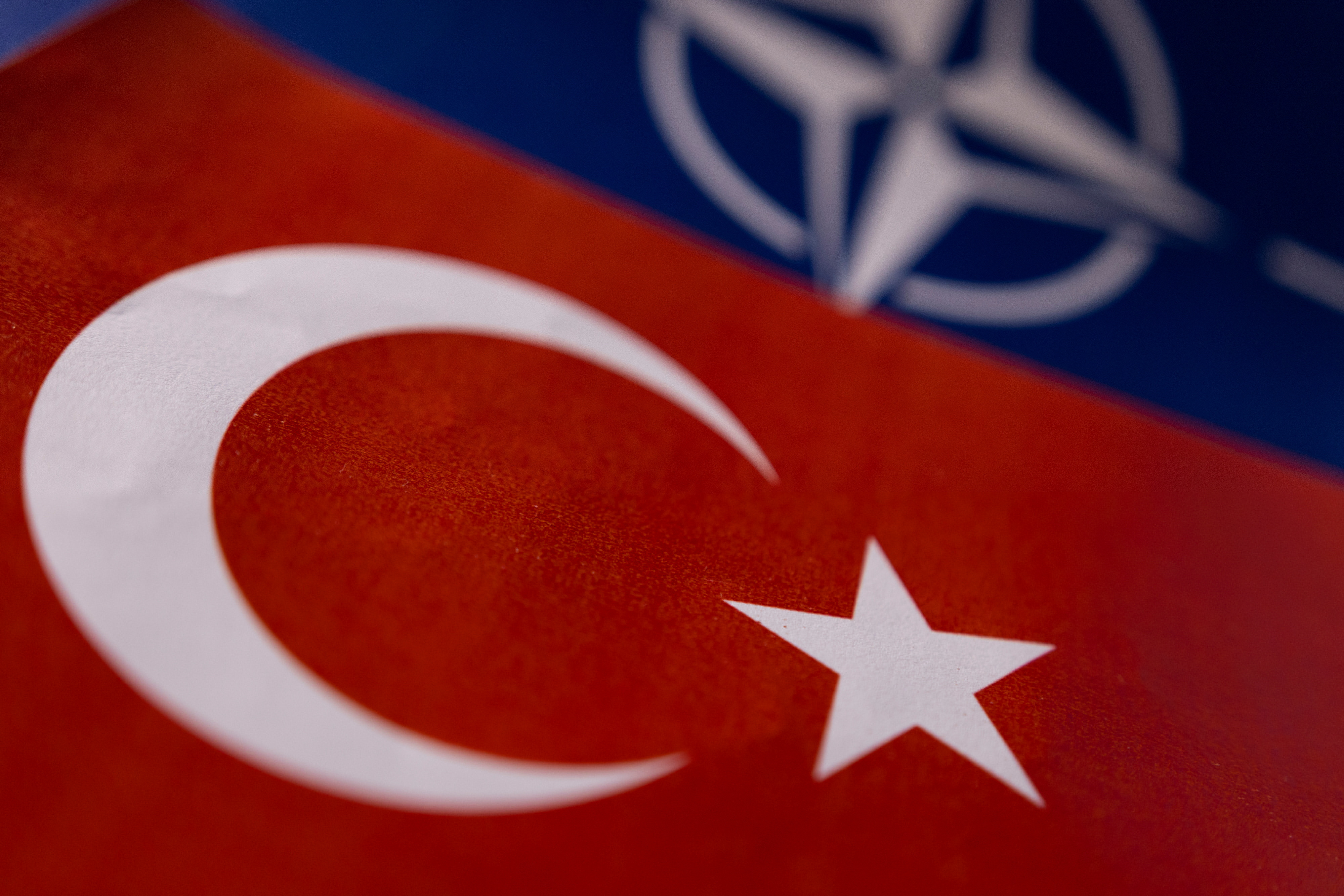 Illustration shows NATO and Turkish flags