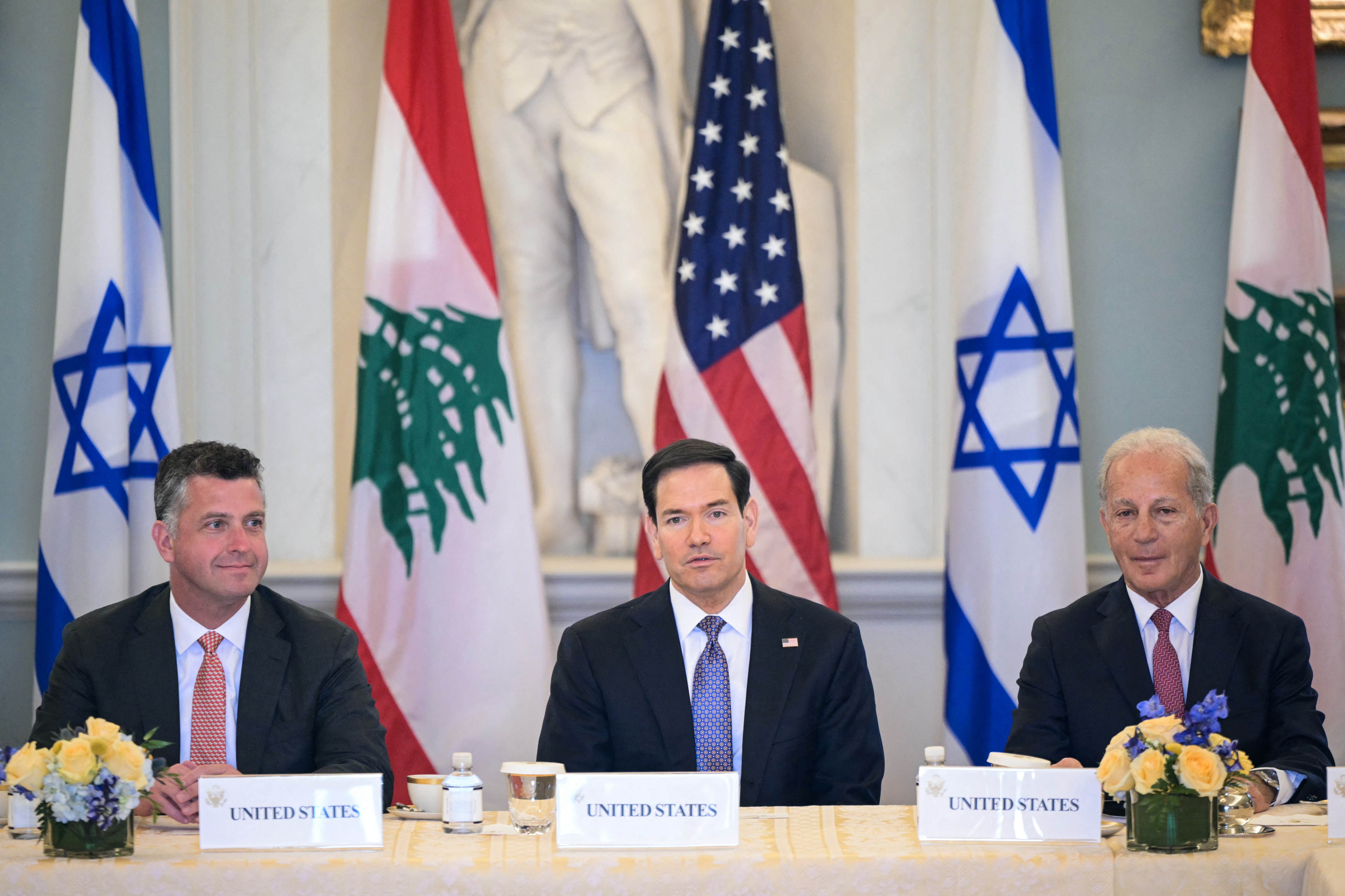US Secretary of State Marco Rubio (C), alongside US State Department Counselor Michael Needham (L) and US Ambassador to Lebanon Michel Issa (R), speaks during a meeting with Lebanon's Ambassador to the US Nada Hamadeh Moawad (out of frame) and Israeli Ambassador to the US Yechiel Leiter (out of frame) at the State Department in Washington, DC, on April 14, 2026. (Photo by Oliver Contreras / AFP)