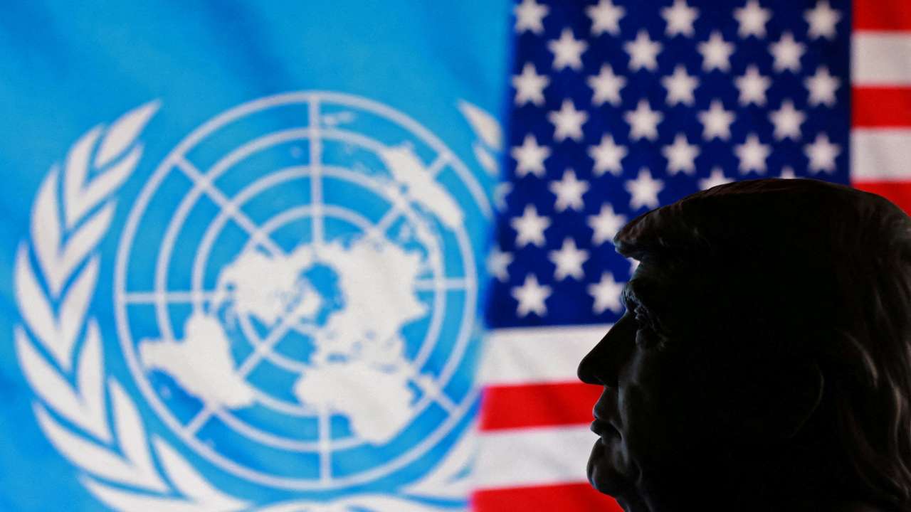 FILE PHOTO: Illustration shows 3D-printed miniature of U.S. President Donald Trump, U.S. flag and UN logo