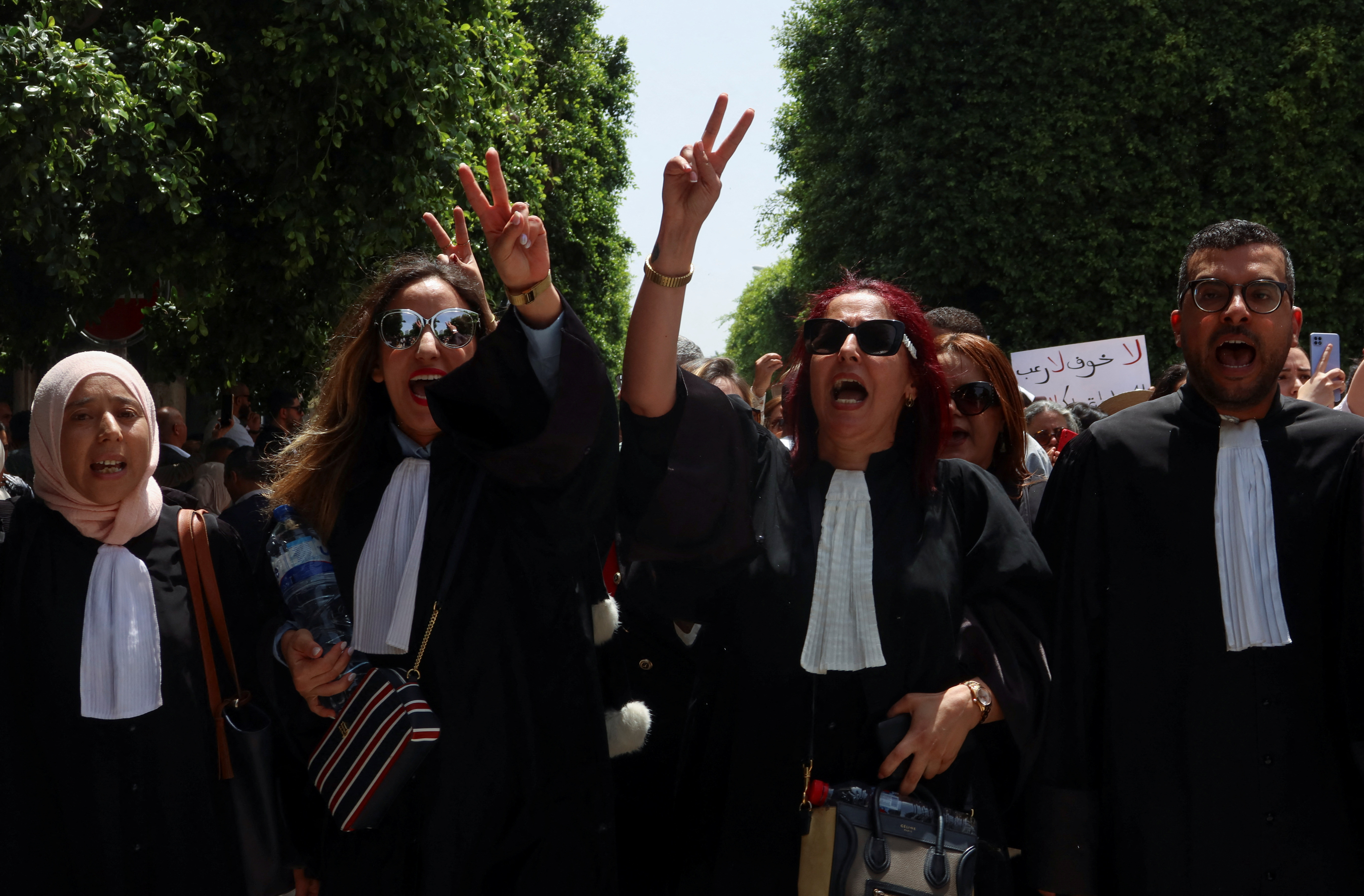Lawyers gesture during a one-day nationwide strike in Tunis