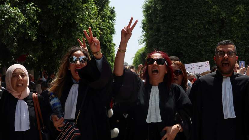 Lawyers gesture during a one-day nationwide strike in Tunis