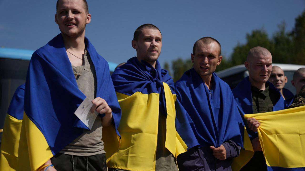 Ukrainian POWs react after a swap at an unknown location in Ukraine