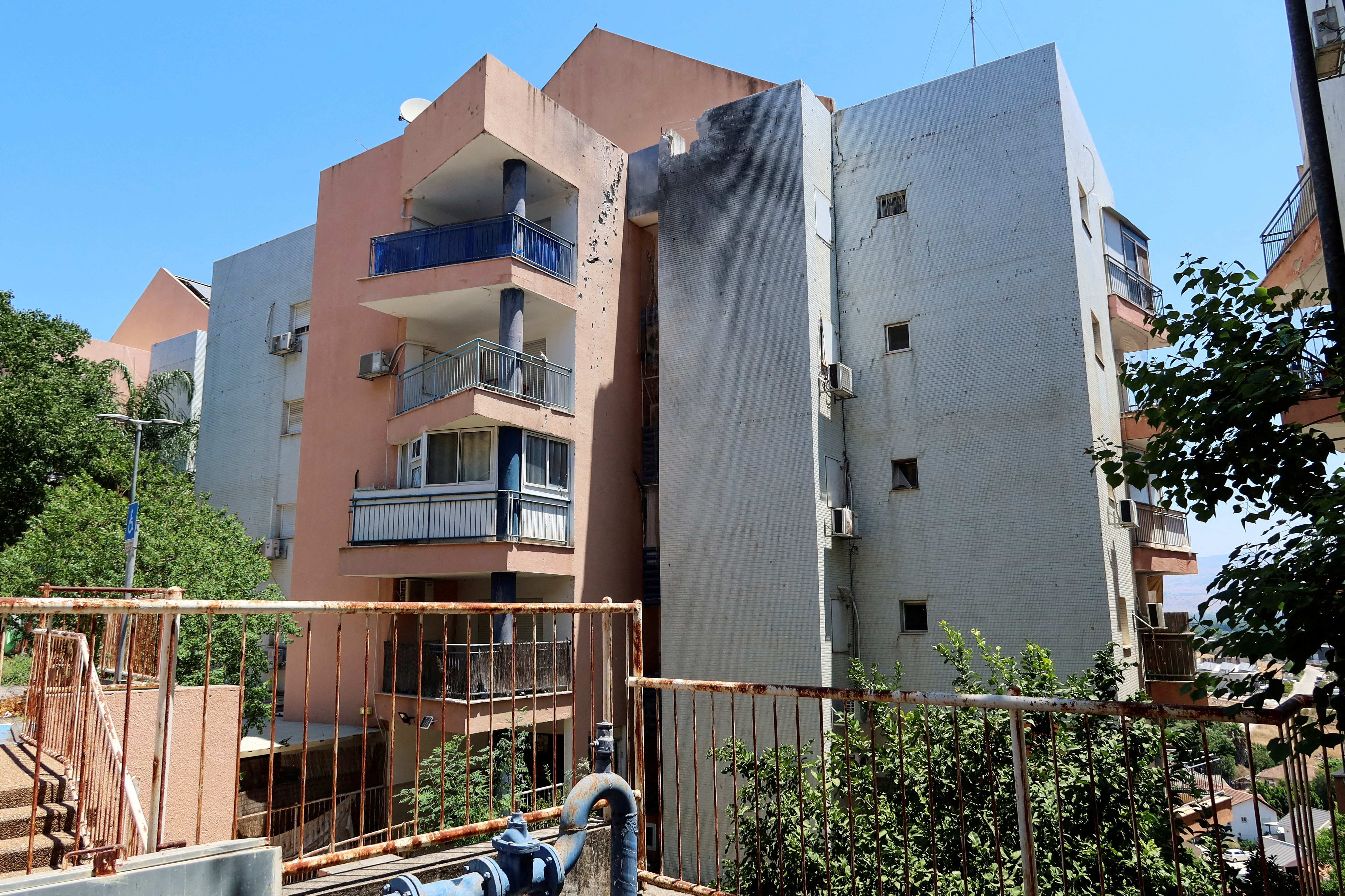 Damage to a residential building after Hezbollah fired a barrage of projectiles towards Israel from Lebanon, amid cross-border hostilities between Hezbollah and Israeli forces, near Kiryat Shmona in northern Israel