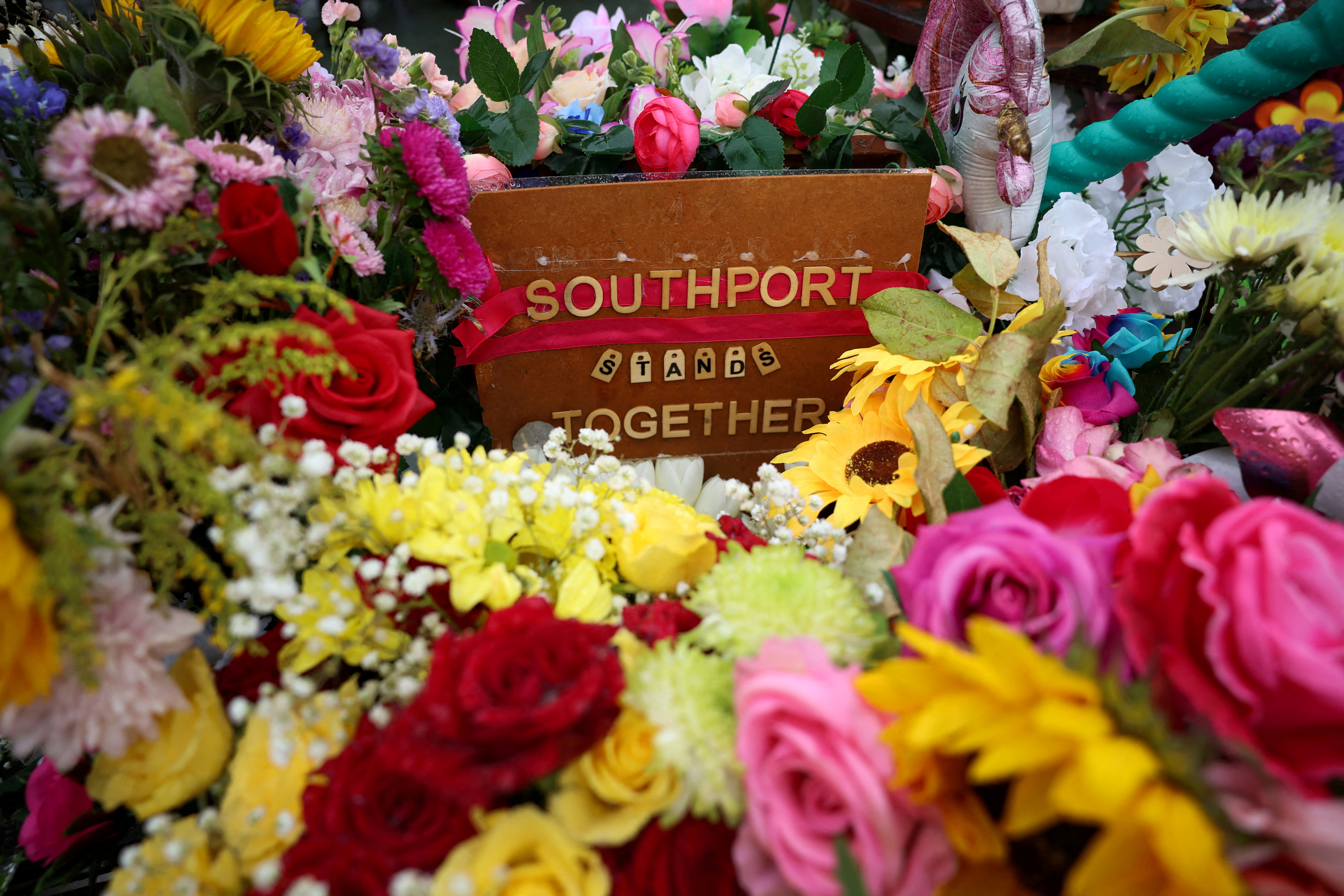 FILE PHOTO: Floral tributes left by members of the public are seen following the fatal knife attack on three young girls in July in Southport