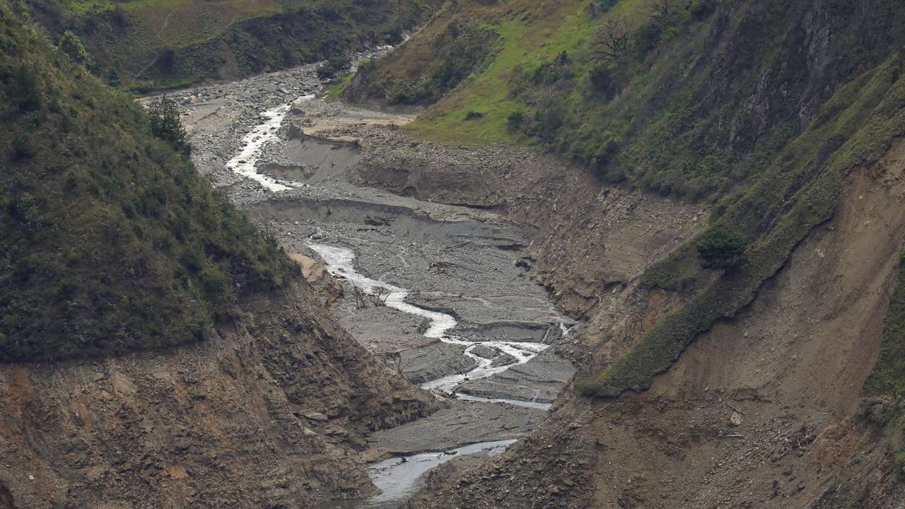 FILE PHOTO: A view shows a small stream that feeds the Paute river, affected by a severe drought, in Paute