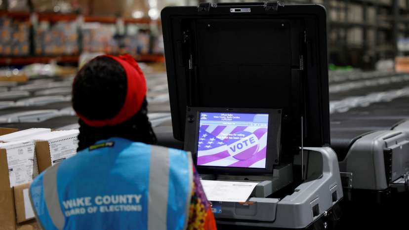 Precinct official tests voting machines in Raleigh