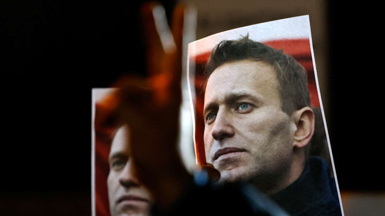 People attend a protest and vigil following the death of Russian opposition leader Alexei Navalny, in Kappara