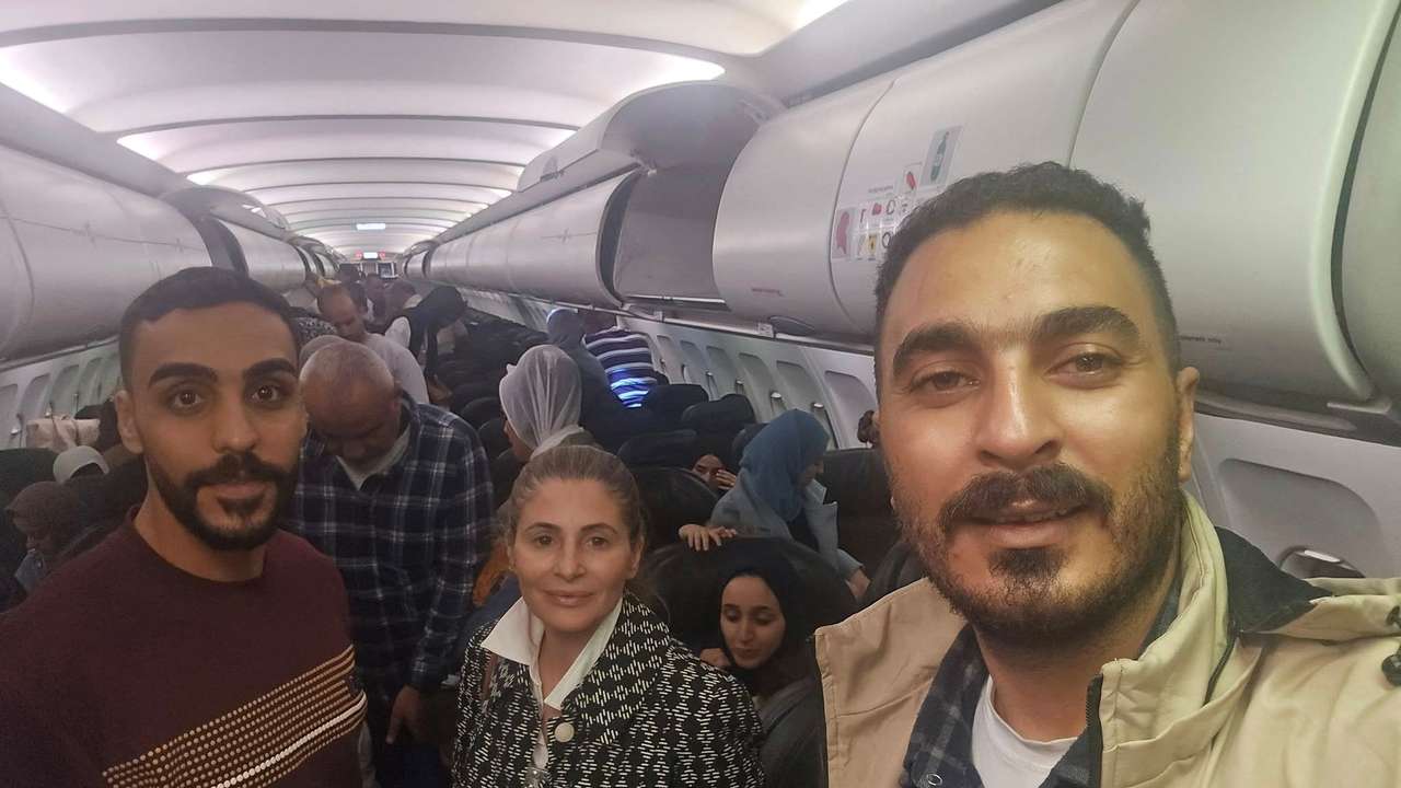 Hanan Jarrar, Palestinian ambassador to South Africa, smiles for a picture on a plane in a location given as given as Johannesburg