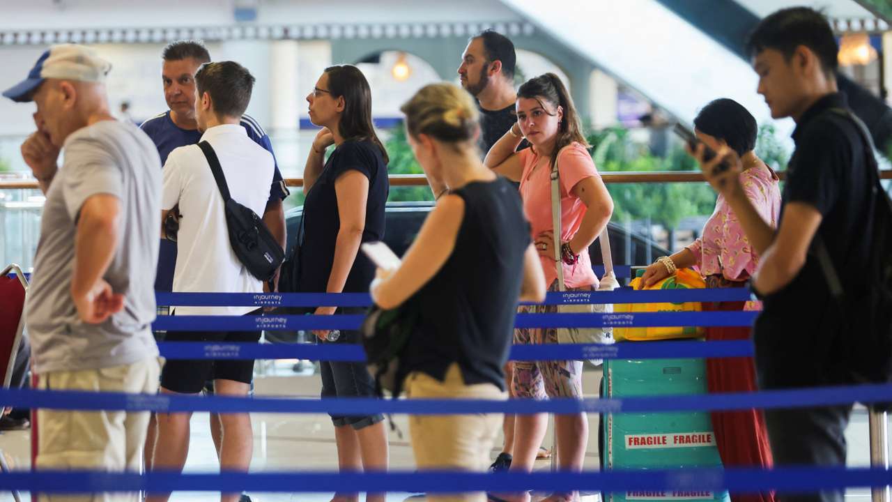 Stranded passengers at I Gusti Ngurah Rai International Airport after flights to Doha, Dubai, and Abu Dhabi were cancelled following strikes on Iran launched by the United States and Israel, in Kuta