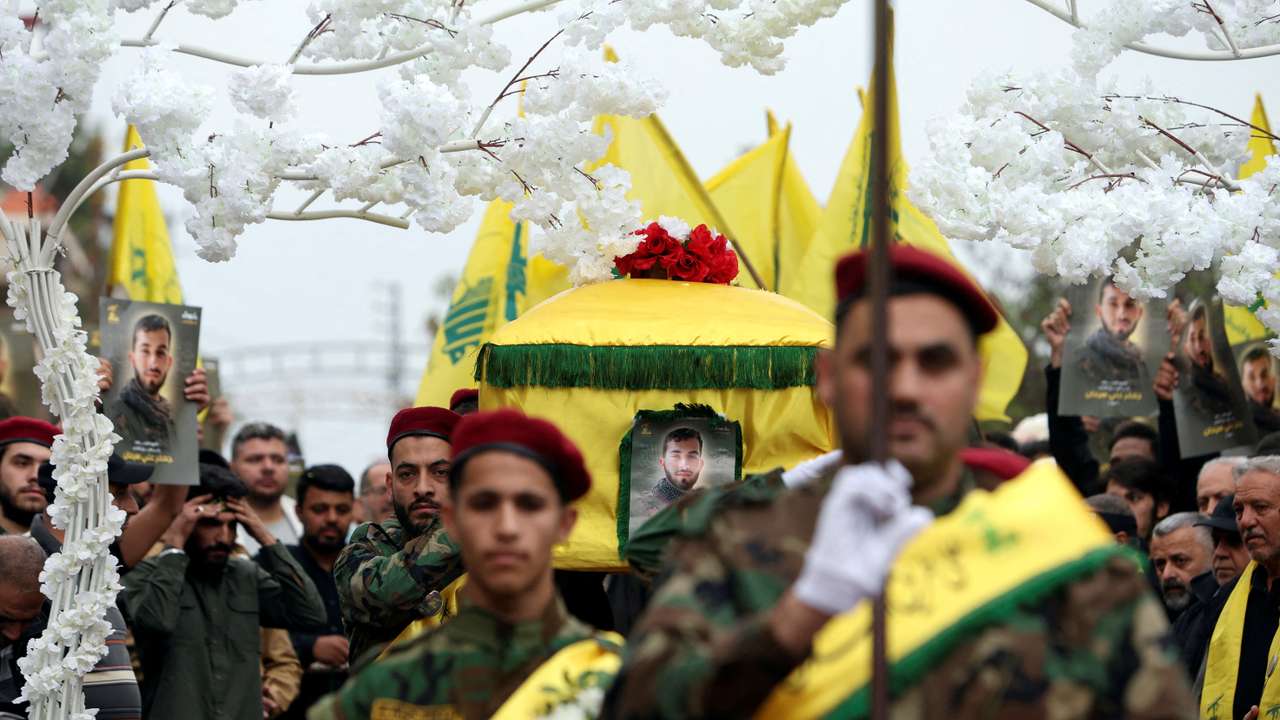 FILE PHOTO: Members of Hezbollah carry the coffin of Hezbollah member Jaafar Serhan, during his funeral in Mashghara
