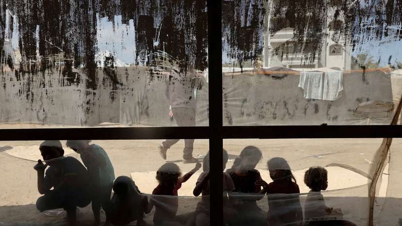 FILE PHOTO: Palestinian children play outside a medical tent in Deir Al-Balah