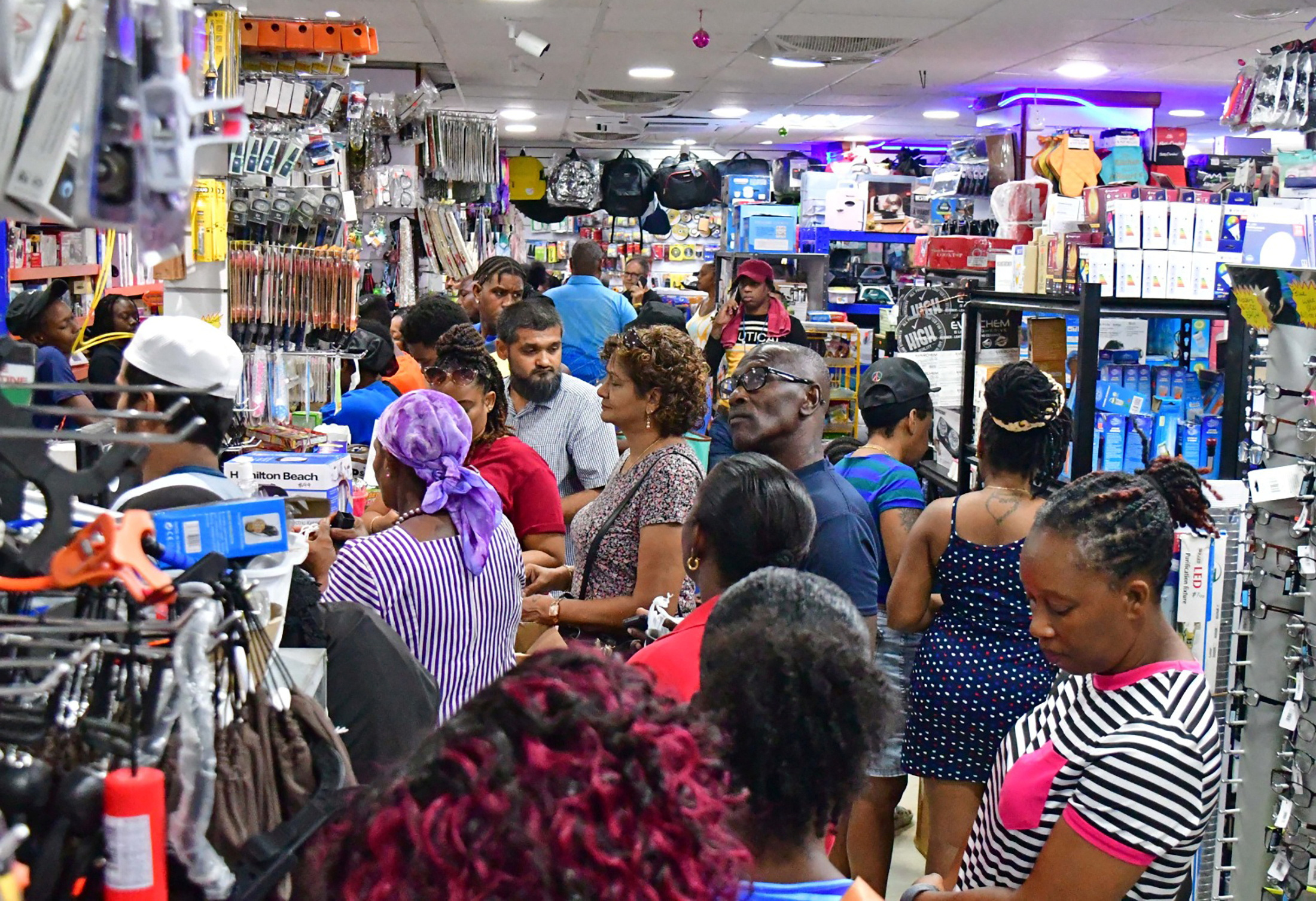 People shop in a supermarket ahead of the arrival of Hurricane Beryl in Bridgetown