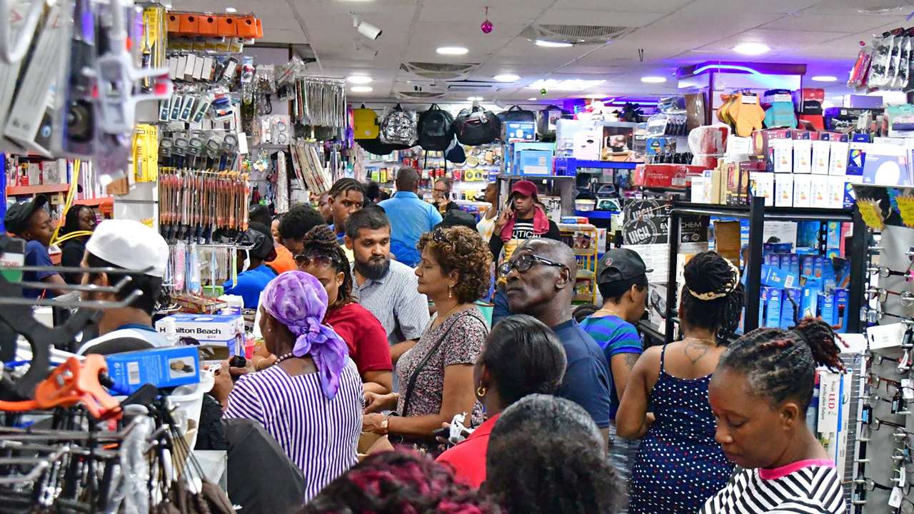 People shop in a supermarket ahead of the arrival of Hurricane Beryl in Bridgetown