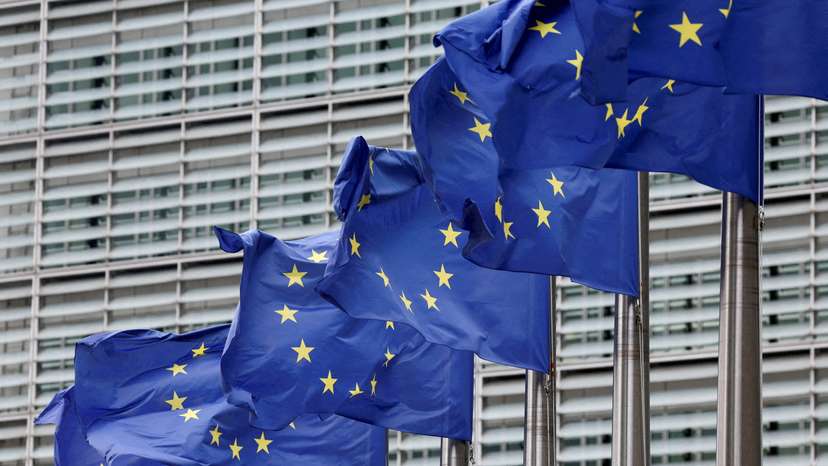 FILE PHOTO: European Union flags flutter outside the EU Commission headquarters in Brussels