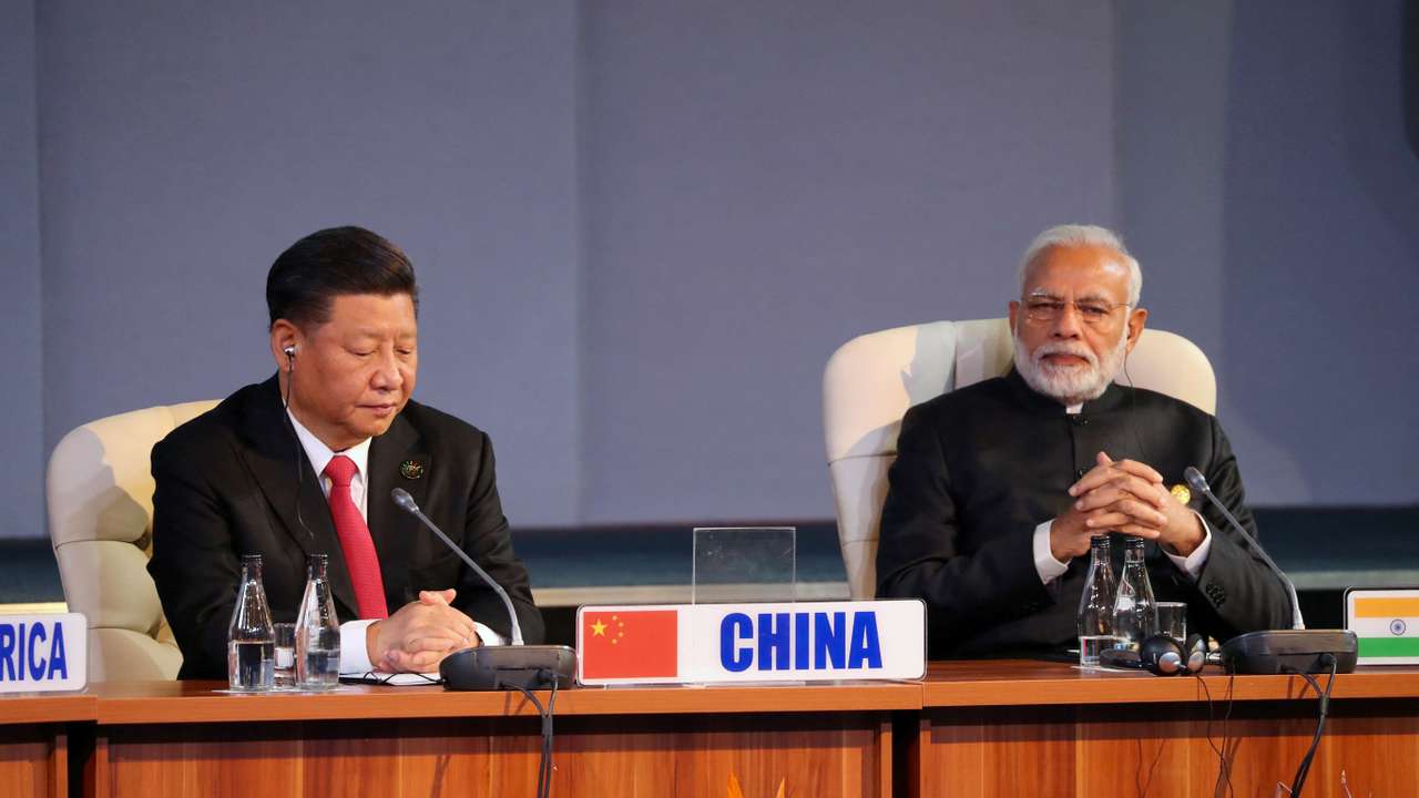 FILE PHOTO: Indian Prime Minister Narendra Modi and China's President Xi Jinping attend the BRICS summit meeting in Johannesburg