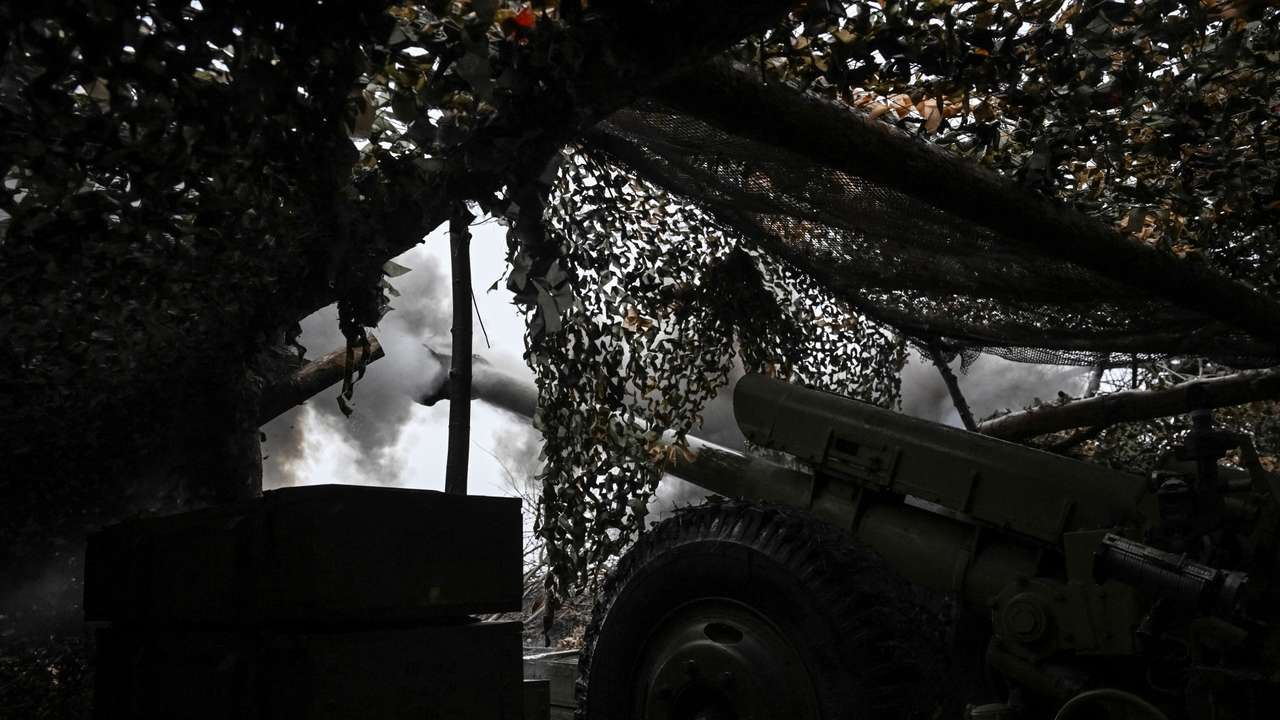 Ukrainian servicemen fire a howitzer towards Russian troops at a position in a front line near the town of Pokrovsk