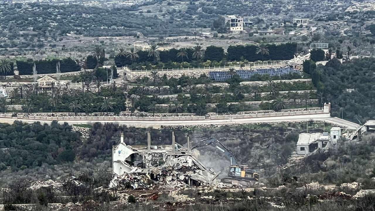 An Israeli military bulldozer works on the Lebanese side of the border between Israel and Lebanon, as seen from Israel