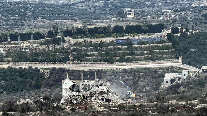 An Israeli military bulldozer works on the Lebanese side of the border between Israel and Lebanon, as seen from Israel