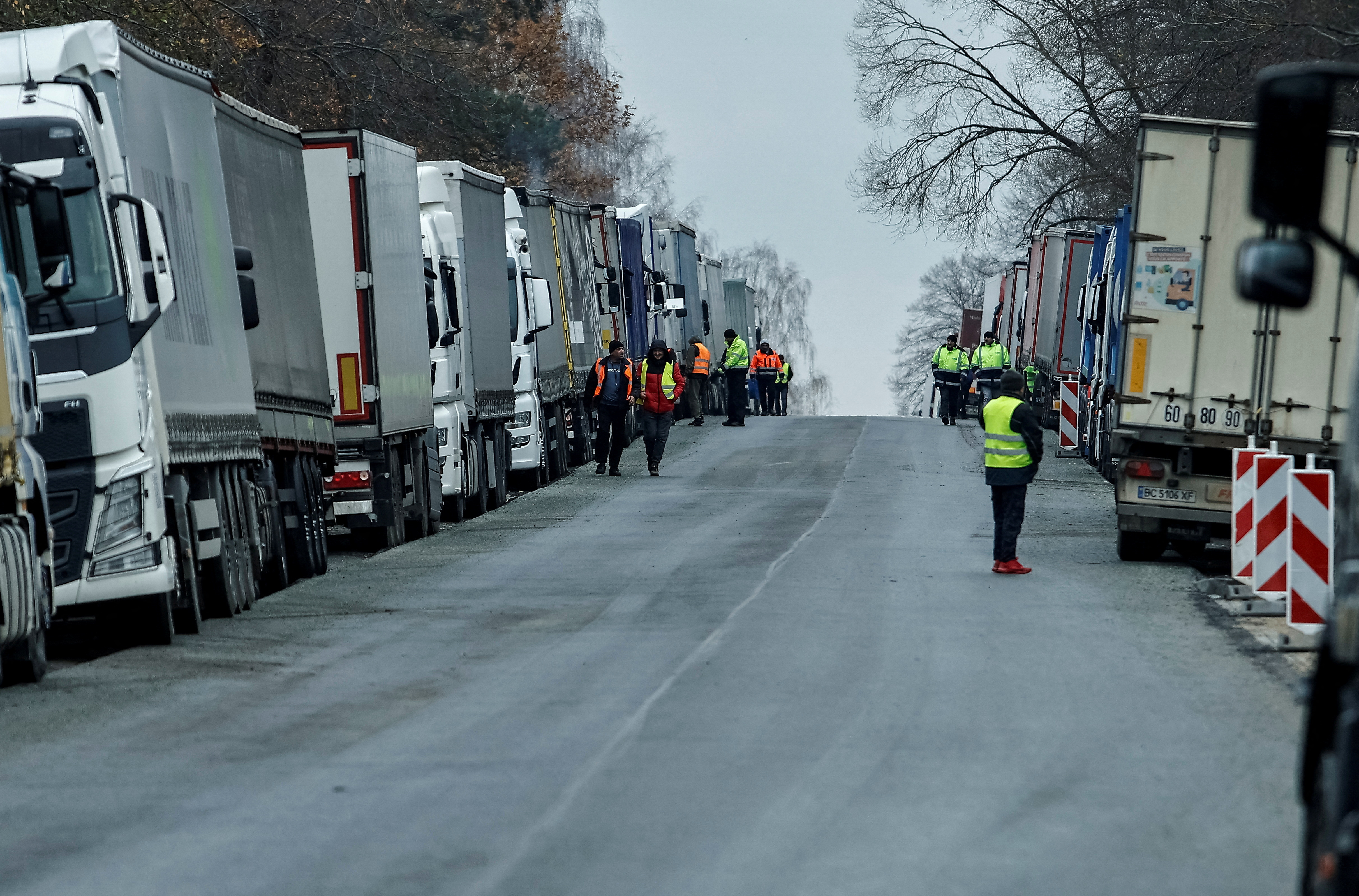 FILE PHOTO: Ukrainian trucks are parked near the Poland-Ukraine border, near the village of Korczowa