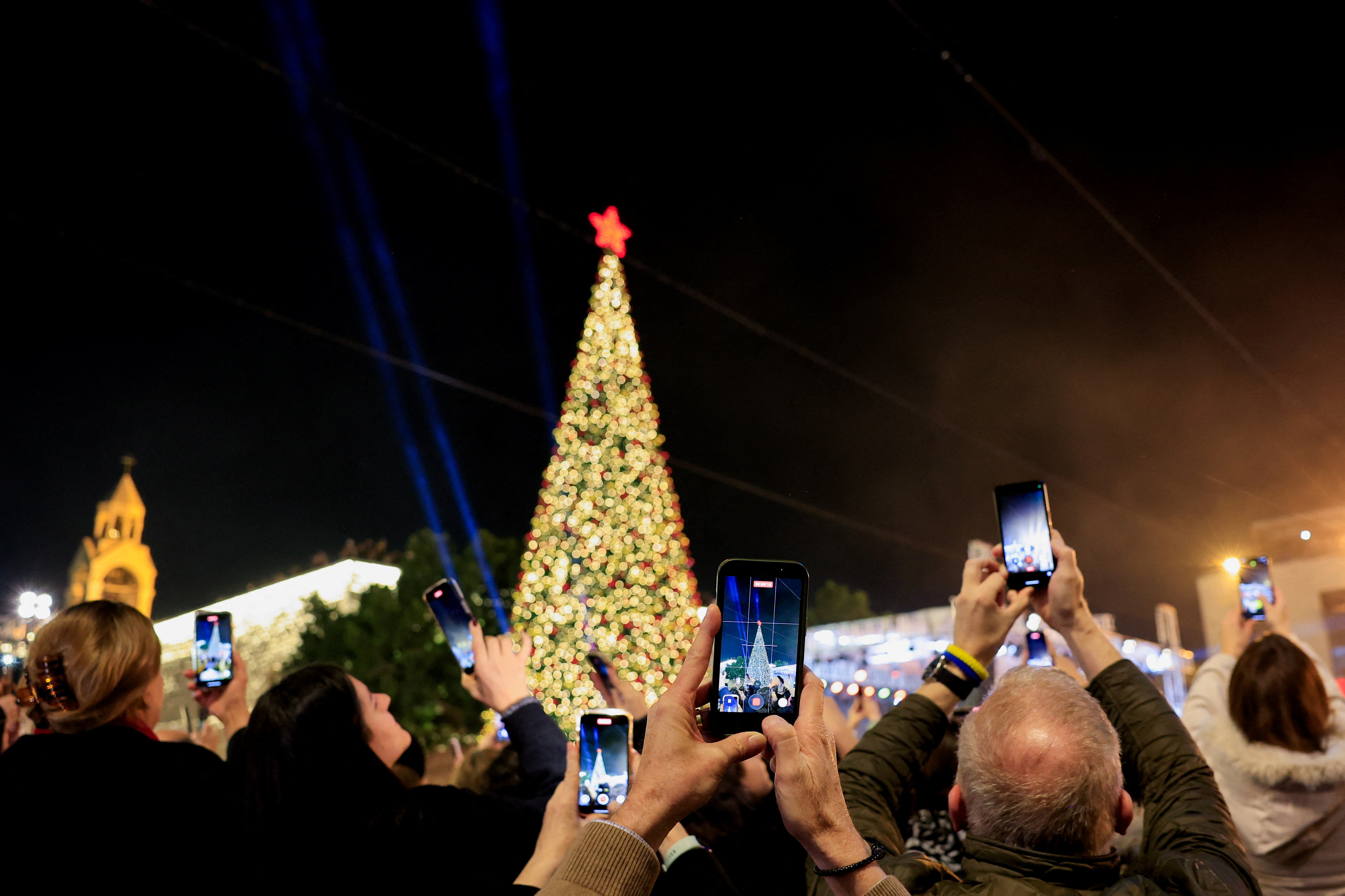Christmas tree lighting-up outside Church of the Nativity in Bethlehem