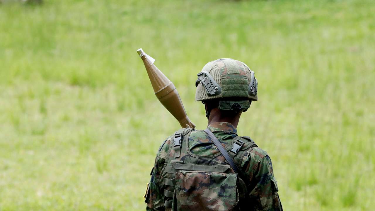 M23 rebels at the Grande Barrier border amid clashes with FARDC at the border crossing point at Gisenyi, in Rubavu district