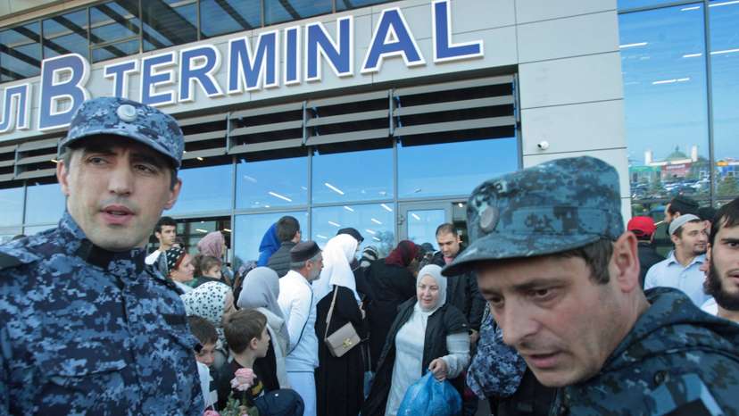 Law enforcement officers ensure security at the airport in Makhachkala