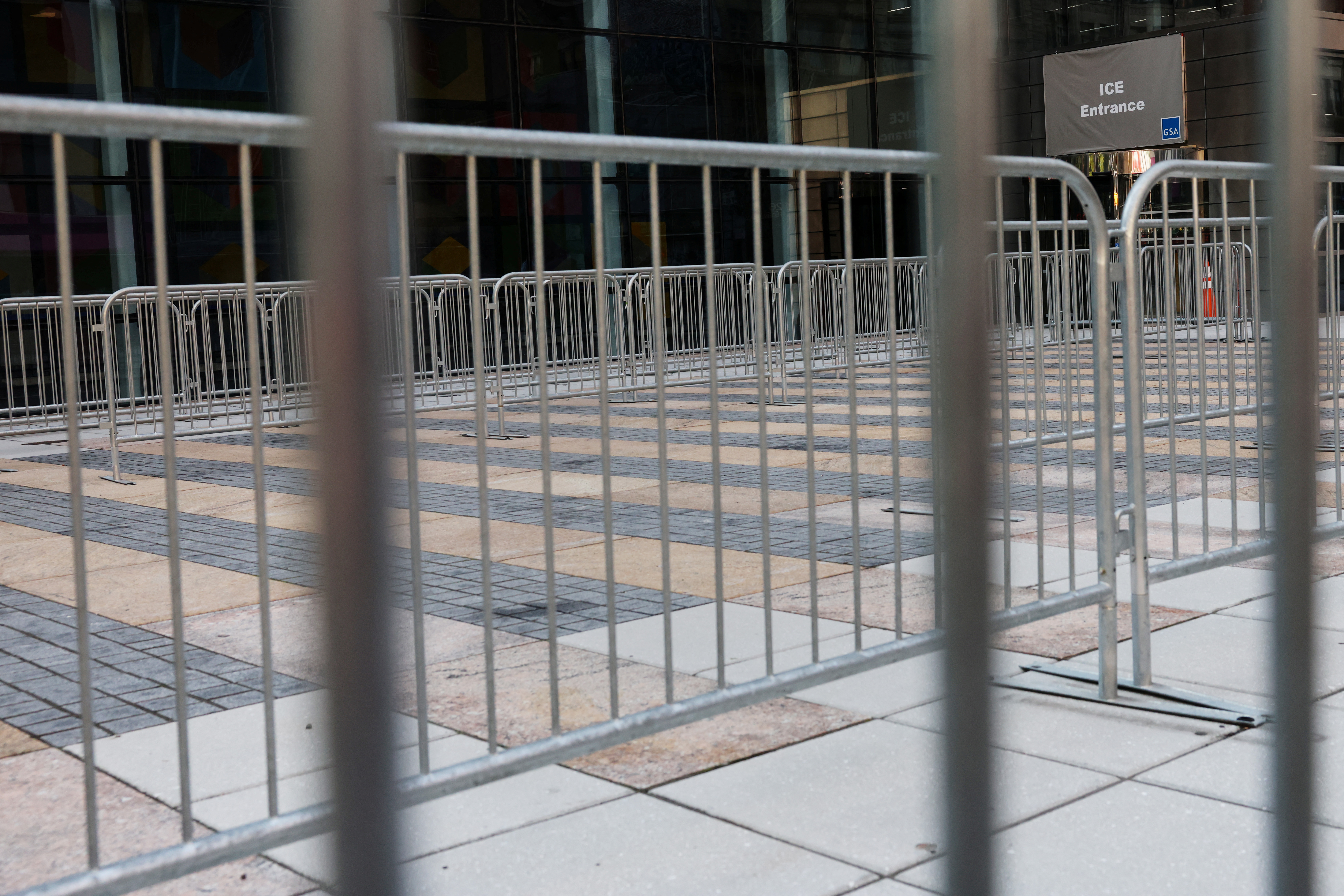 The entrance to the U.S. Immigration and Customs Enforcement (ICE) office stands behind fences outside 26 Federal Plaza in New York City