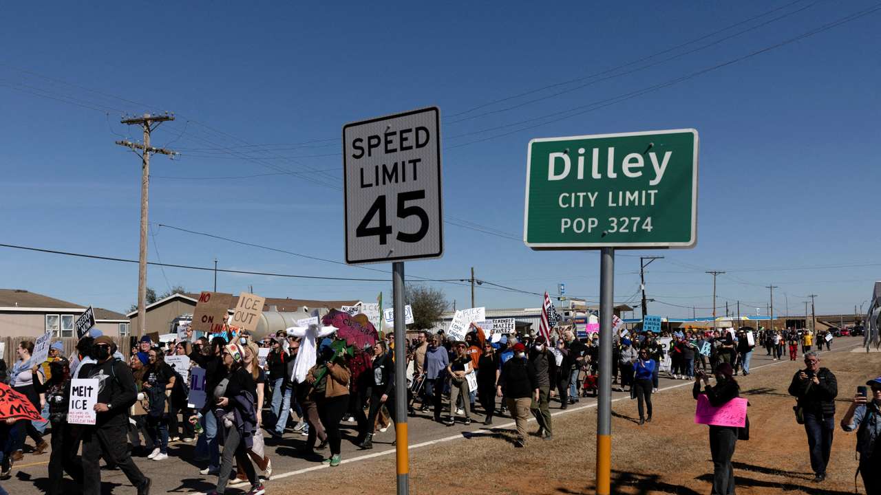 FILE PHOTO: People march to take part in a protest at the South Texas Family Residential Center in Dilley, Texas,