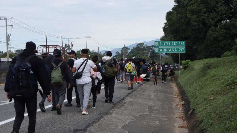 Migrants walk in a caravan in an attempt to reach the U.S. border, in Tapachula