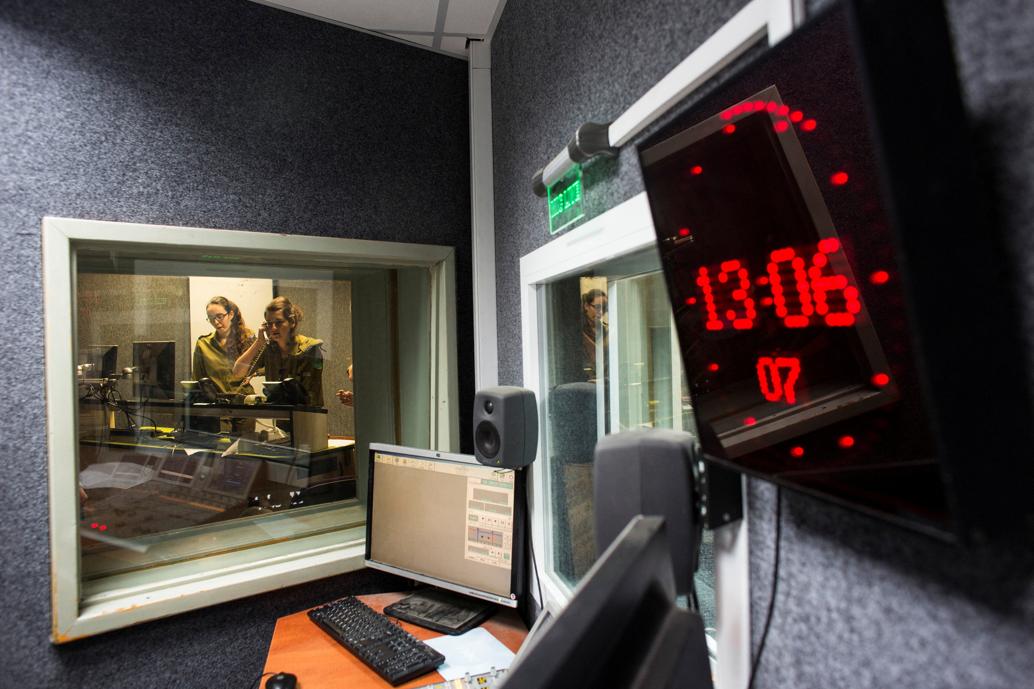 FILE PHOTO: Israeli soldiers from the Israeli army radio station produce a show in Jaffa