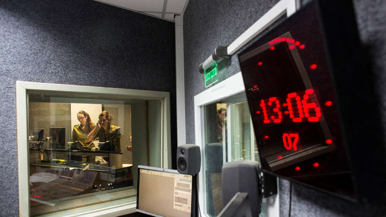 FILE PHOTO: Israeli soldiers from the Israeli army radio station produce a show in Jaffa
