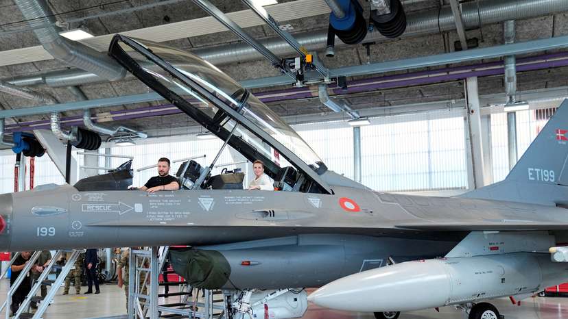 FILE PHOTO: Ukrainian President Volodymyr Zelenskiy and Danish Prime Minister Mette Frederiksen sit in an F-16 fighter jet at Skrydstrup Air Base in Vojens