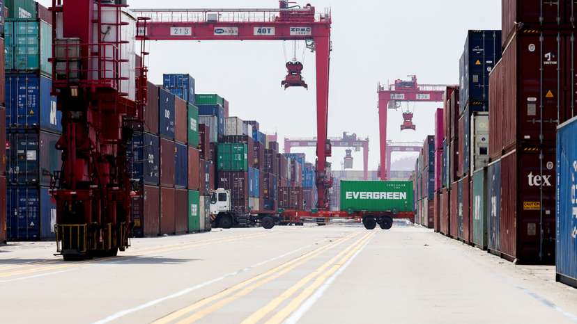 Gantry cranes stand near shipping containers at Yangshan Port outside of Shanghai