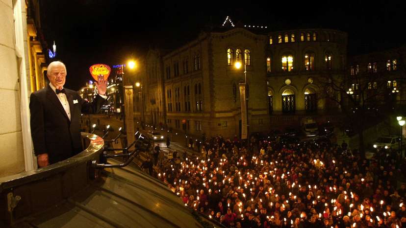 FILE PHOTO: Nobel Peace Prize winner and former U.S. President Jimmy Carter greets a torchlight procession from the balcony of the Grand Hotel in downtown Oslo