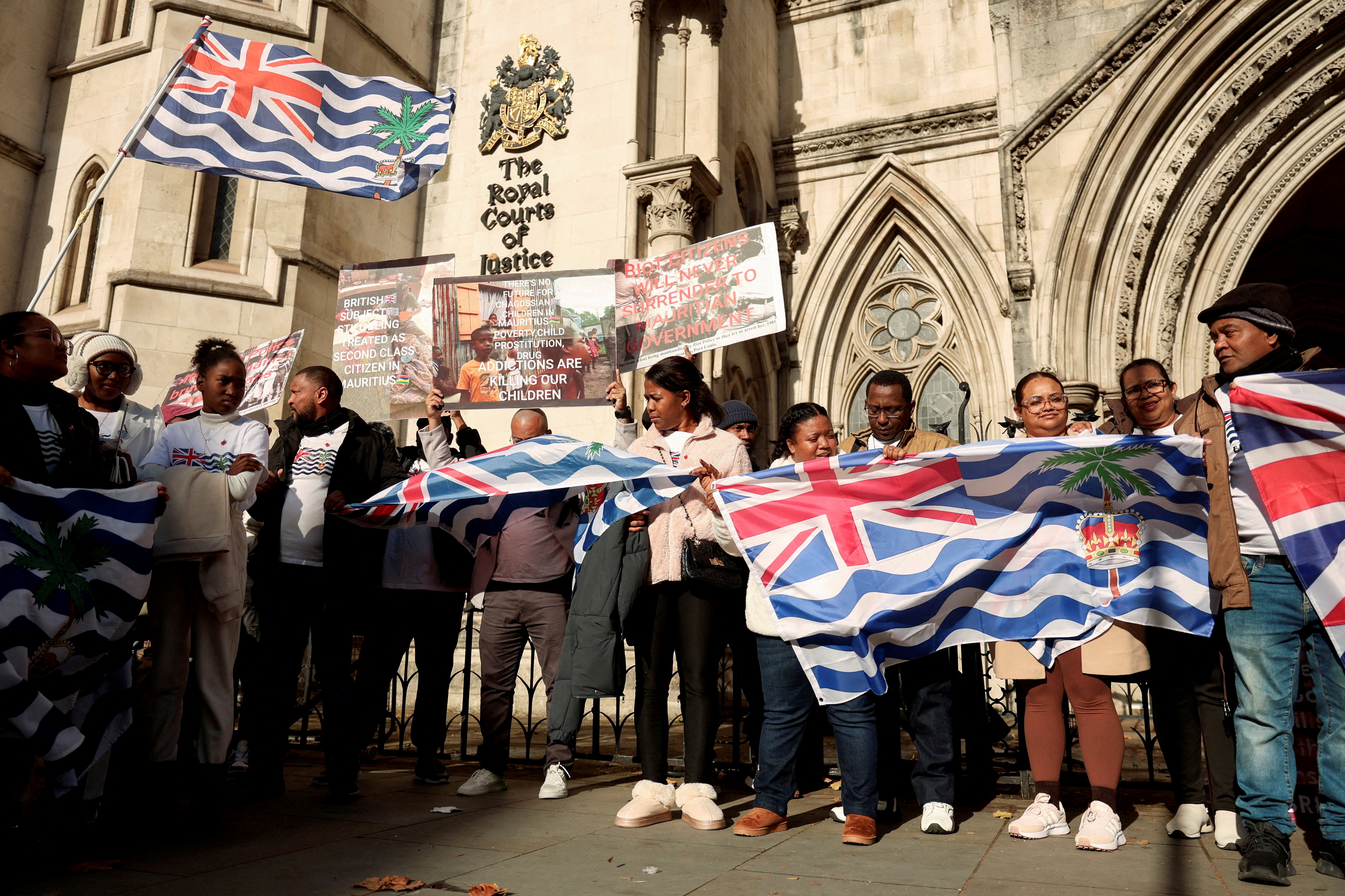 FILE PHOTO: FILE PHOTO: Campaigners oppose Britain’s Chagos deal outside High Court