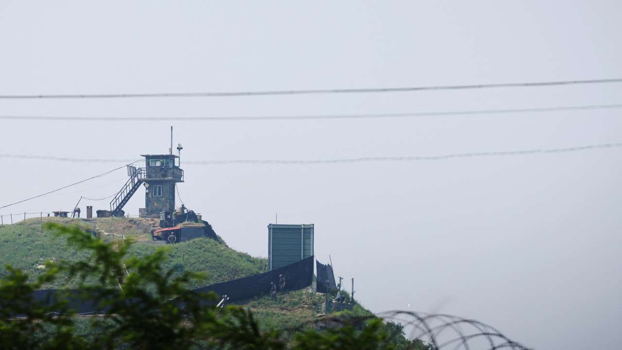 South Korean soldiers walk past a military facility where loudspeakers dismantled in 2018 used to be, near the demilitarized zone separating the two Koreas in Paju