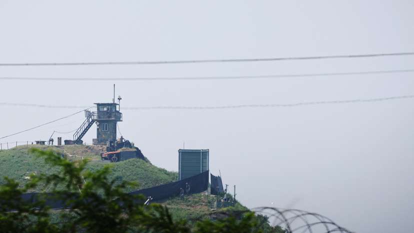 South Korean soldiers walk past a military facility where loudspeakers dismantled in 2018 used to be, near the demilitarized zone separating the two Koreas in Paju