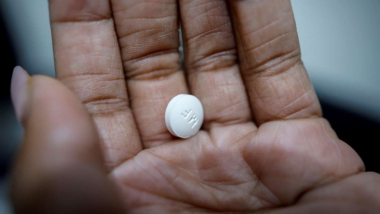 FILE PHOTO: A patient prepares to take Mifepristone, the first medication in a medical abortion, at Alamo Women's Clinic in Carbondale