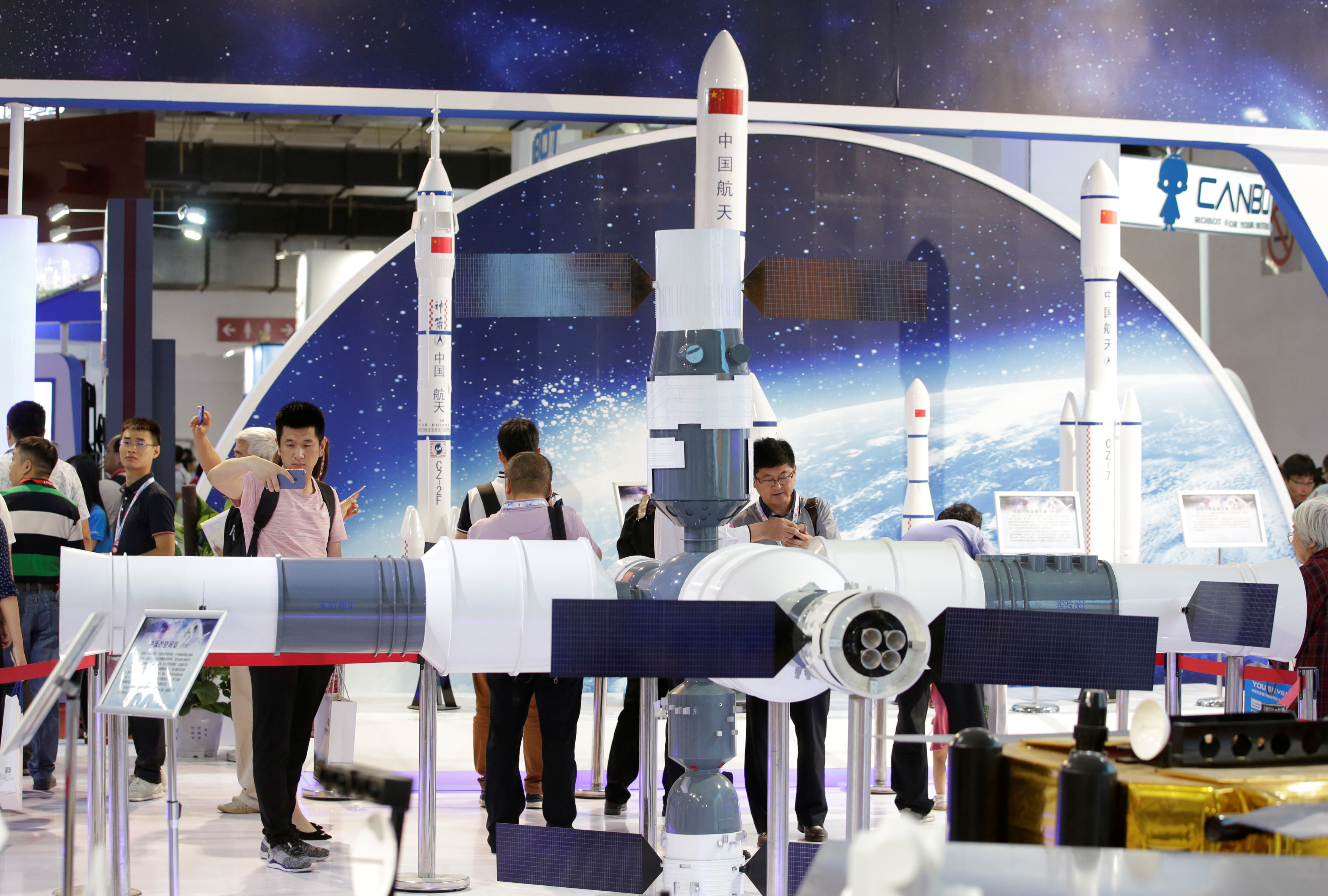 People visit the booth of China Aerospace Science and Technology Corporation at China Beijing International High-tech Expo in Beijing