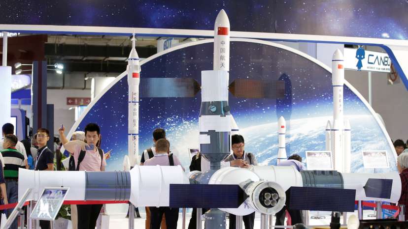 People visit the booth of China Aerospace Science and Technology Corporation at China Beijing International High-tech Expo in Beijing