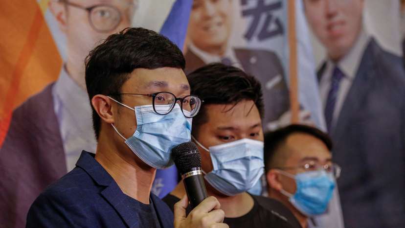 Political activist Ventus Lau Wing-hong speaks to the media after he was disqualified from running for election for the legislature in Hong Kong