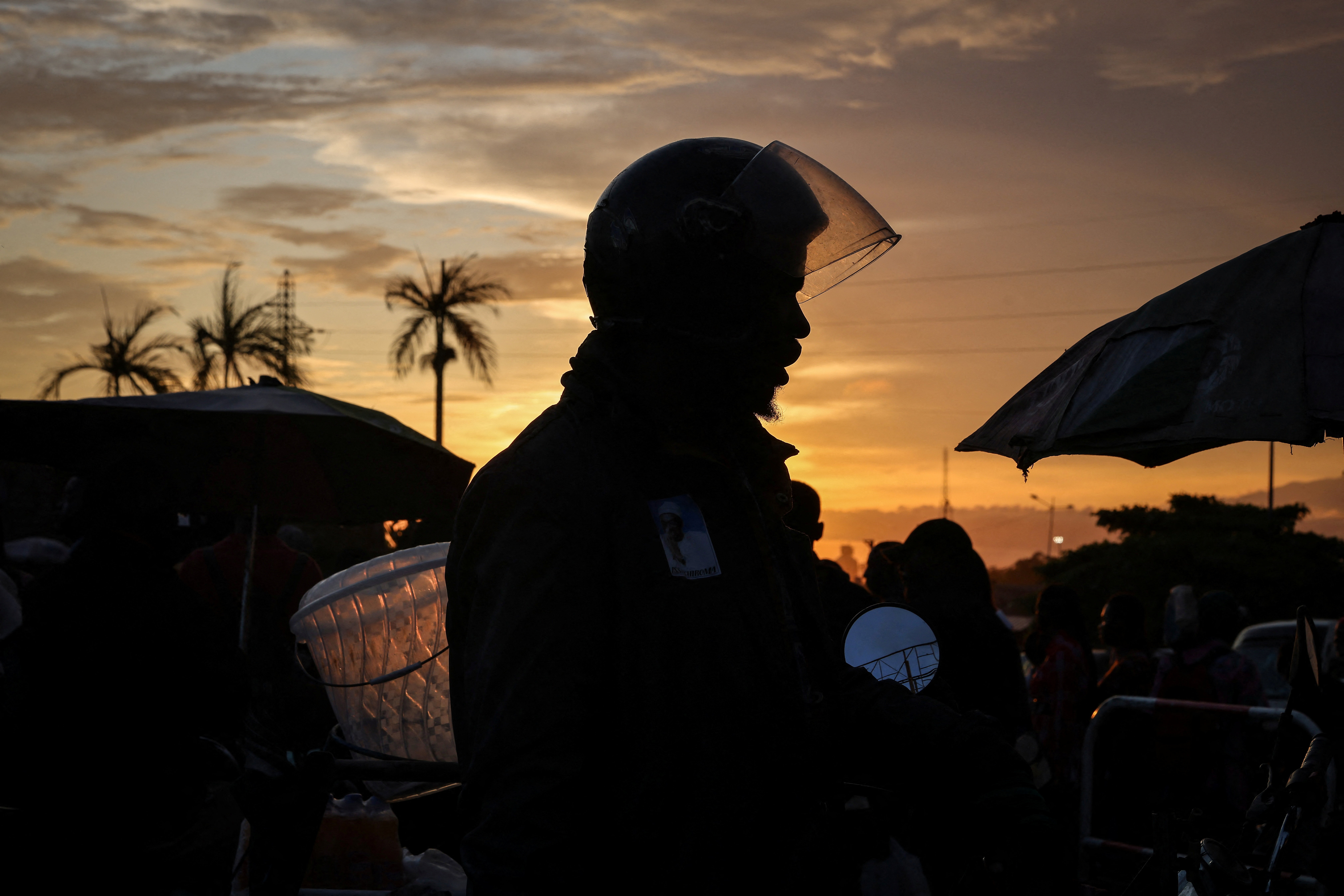 The Wider Image: Motorcycle taxi drivers of Cameroon's Douala long for jobs and escape