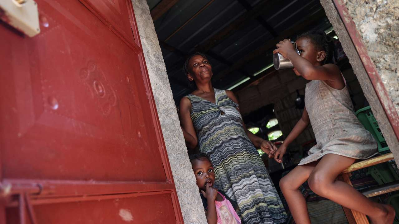 The Wider Image: Camping in schools, hungry Haiti families ask: when will normality return?