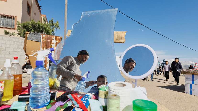 Displaced Palestinian, who fled their houses due to Israeli strikes, take shelter in a tent camp in Rafah