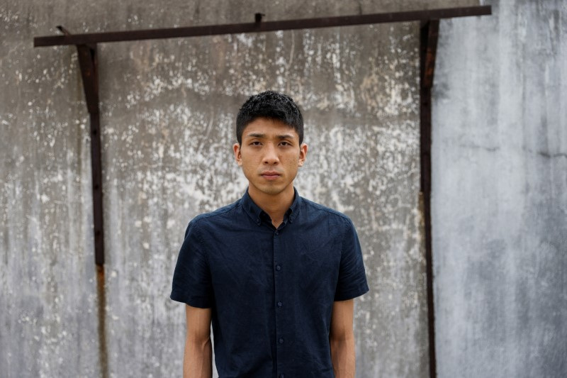 Pro-democracy activist Owen Chow poses for photo after an interview in Hong Kong