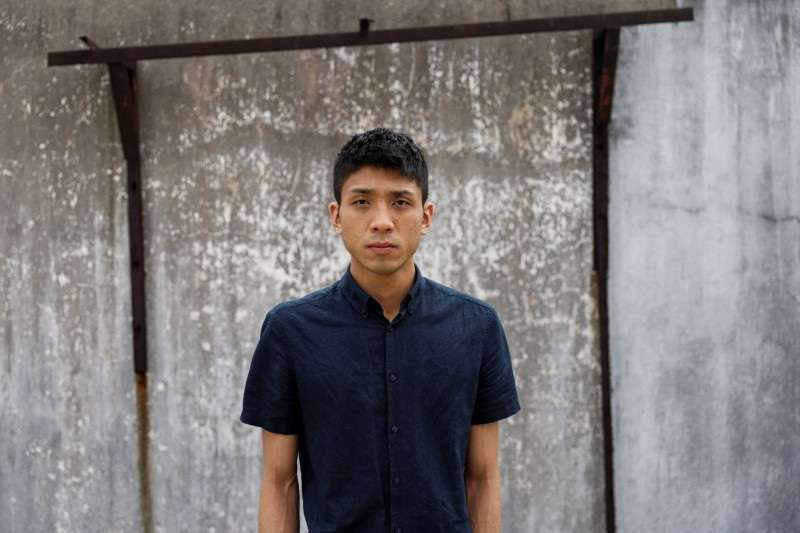 Pro-democracy activist Owen Chow poses for photo after an interview in Hong Kong